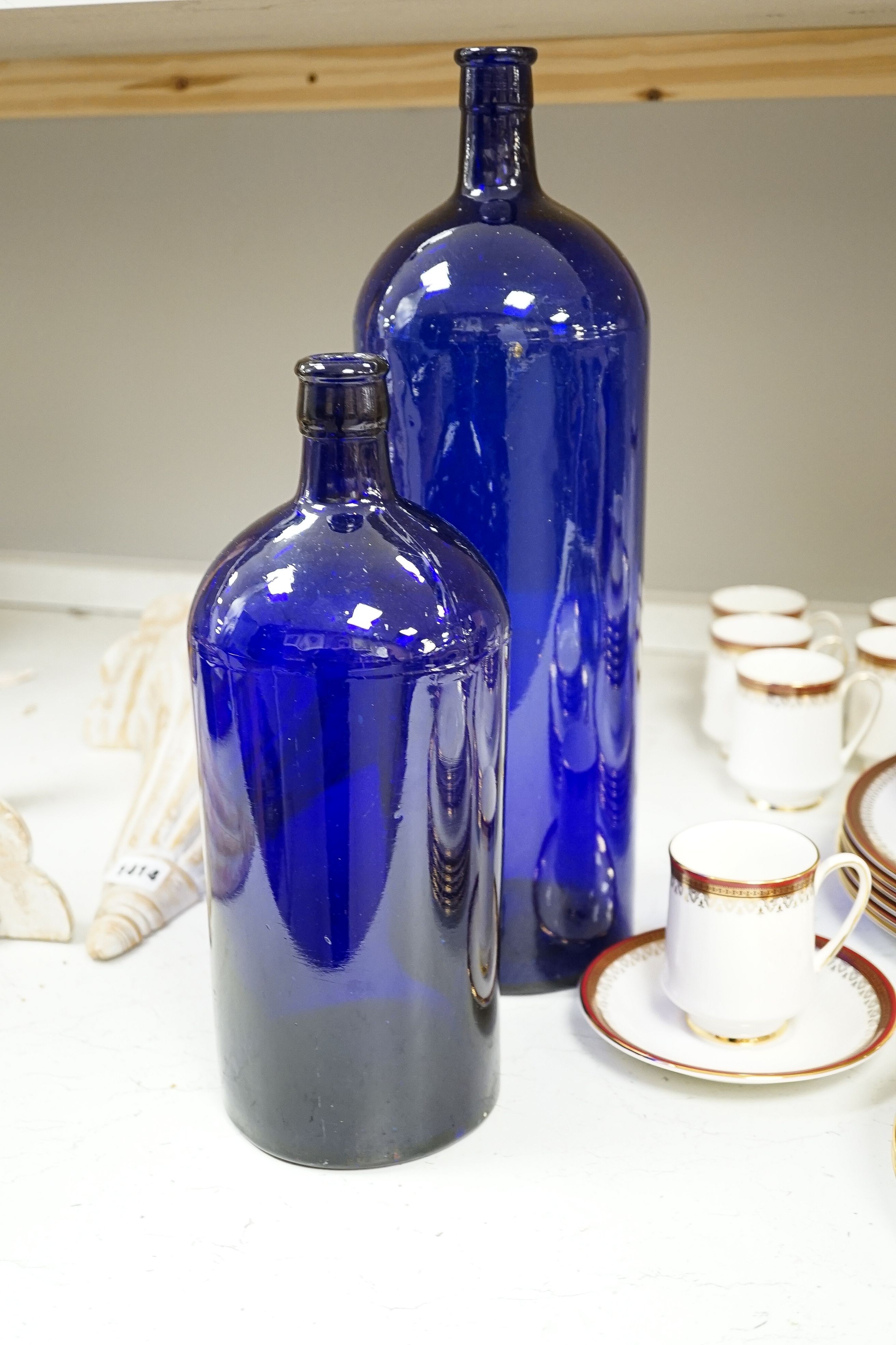 A Royal Albert Holyrood pattern dinner and coffee service and two deep blue pressed glass apothecary bottles